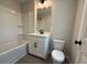 Bathroom featuring a shower-tub combo, and modern vanity with dark fixtures at 1923 Cassia Aly, Kennesaw, GA 30144