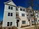 Charming townhome featuring mixed brick and siding, complemented by large windows and a covered entryway at 1923 Cassia Aly, Kennesaw, GA 30144