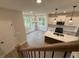 Bright kitchen with island, white cabinets, stainless steel appliances, and recessed lighting providing a functional space at 1923 Cassia Aly, Kennesaw, GA 30144