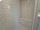 Shower stall with white subway tile surround and built-in seating at 1923 Cassia Aly, Kennesaw, GA 30144