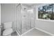 Bathroom featuring a large glass shower and window at 3175 Tackett Rd, Douglasville, GA 30135