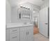 The bathroom has a white sink and cabinet, a large mirror, and modern lighting at 3175 Tackett Rd, Douglasville, GA 30135