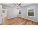 Bedroom featuring hardwood floors, large windows and an ensuite at 3175 Tackett Rd, Douglasville, GA 30135