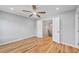 This bedroom features hardwood floors and views to the stairway at 3175 Tackett Rd, Douglasville, GA 30135