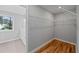 Walk-in closet featuring hardwood floors and custom shelving at 3175 Tackett Rd, Douglasville, GA 30135