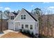 Two-story home with light siding, attached garage, and ample natural light at 3175 Tackett Rd, Douglasville, GA 30135