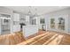 Modern kitchen with stainless steel appliances, white cabinets, and island with deck access at 3175 Tackett Rd, Douglasville, GA 30135