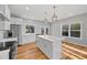 Spacious kitchen with a large island, white cabinets, and stainless steel refrigerator at 3175 Tackett Rd, Douglasville, GA 30135