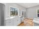 Well-lit kitchen with stainless steel appliances, white countertops, and wooden floors at 3175 Tackett Rd, Douglasville, GA 30135