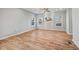 Bright living room featuring hardwood floors, neutral paint, and large windows at 3175 Tackett Rd, Douglasville, GA 30135