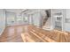 Open-concept floor plan with hardwood floors and a staircase visible from the living area at 3175 Tackett Rd, Douglasville, GA 30135