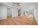 Open-concept living room showcasing hardwood floors and open stairway at 3175 Tackett Rd, Douglasville, GA 30135