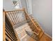 Detailed staircase with oak wood and black iron spindles with a view from the top landing at 3175 Tackett Rd, Douglasville, GA 30135