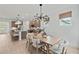 View of dining area with modern chandelier and view of kitchen with stainless appliances at 628 Topsail Drive Pkwy, Villa Rica, GA 30180