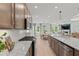 Modern kitchen showcases sleek countertops, a stainless steel range, and an open layout extending to the living area at 628 Topsail Drive Pkwy, Villa Rica, GA 30180