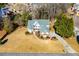 Aerial view of a traditional home with well-manicured lawns and gardens at 2003 Hubbard Ct, Villa Rica, GA 30180