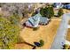 Aerial view of a house with a fenced backyard and other houses nearby at 2003 Hubbard Ct, Villa Rica, GA 30180