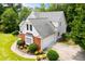 Aerial view of home with mature trees and an attached garage at 2003 Hubbard Ct, Villa Rica, GA 30180