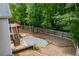 Large backyard featuring a wooden fence, patio area, and lush greenery, perfect for outdoor enjoyment at 2003 Hubbard Ct, Villa Rica, GA 30180