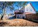 Spacious backyard featuring a wooden deck, patio, and fenced yard at 2003 Hubbard Ct, Villa Rica, GA 30180