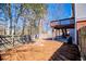 View of backyard, fence, trees, deck, and patio area at 2003 Hubbard Ct, Villa Rica, GA 30180