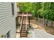 Backyard with deck and stairs leading to the grass at 2003 Hubbard Ct, Villa Rica, GA 30180