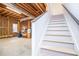 Unfinished basement with stairs leading down from the upper floors at 2003 Hubbard Ct, Villa Rica, GA 30180