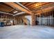 Unfinished basement with exposed beams and concrete floor at 2003 Hubbard Ct, Villa Rica, GA 30180