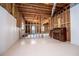 Partially finished basement with white painted walls and supports, featuring a vintage piano at 2003 Hubbard Ct, Villa Rica, GA 30180
