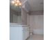 Well-lit bathroom features a large vanity with generous counter space and a shower-tub combination at 2003 Hubbard Ct, Villa Rica, GA 30180