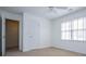 Bright bedroom with neutral carpet, ceiling fan, and a window that allows for natural light at 2003 Hubbard Ct, Villa Rica, GA 30180