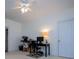 Bright room with a ceiling fan, and a dedicated workspace with a desk and computer setup at 2003 Hubbard Ct, Villa Rica, GA 30180