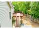 Elevated deck with stairs, ideal for outdoor entertaining and relaxation in a private setting at 2003 Hubbard Ct, Villa Rica, GA 30180