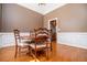 Dining room with hardwood floors, crown molding, and a round wooden table at 2003 Hubbard Ct, Villa Rica, GA 30180