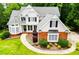 Beautiful home featuring a landscaped yard, brick accents, and a welcoming entrance at 2003 Hubbard Ct, Villa Rica, GA 30180