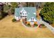 A charming aerial view reveals a two-story home with mature landscaping, a manicured lawn, and a curved walkway at 2003 Hubbard Ct, Villa Rica, GA 30180