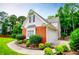 Charming home featuring a brick accent, attached two-car garage, and landscaped yard at 2003 Hubbard Ct, Villa Rica, GA 30180