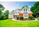Charming two-story home with well-manicured lawn and landscaped garden at 2003 Hubbard Ct, Villa Rica, GA 30180
