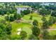 Picturesque aerial view of a lush golf course with manicured greens and scenic water features at 2003 Hubbard Ct, Villa Rica, GA 30180
