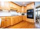 Kitchen with wood cabinets, granite countertops, and stainless steel appliances at 2003 Hubbard Ct, Villa Rica, GA 30180
