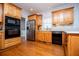 Lovely kitchen with hardwood floors, updated appliances, and beautiful wood cabinetry at 2003 Hubbard Ct, Villa Rica, GA 30180