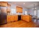 Traditional kitchen with wood cabinets, stainless steel appliances, and hardwood floors at 2003 Hubbard Ct, Villa Rica, GA 30180
