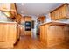 Traditional kitchen with wooden cabinetry, stainless steel appliances, and hardwood flooring at 2003 Hubbard Ct, Villa Rica, GA 30180