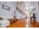 Living room featuring high ceilings, hardwood floors, and staircase at 2003 Hubbard Ct, Villa Rica, GA 30180