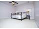 Spacious main bedroom with trey ceilings, carpeted floors, and large windows at 2003 Hubbard Ct, Villa Rica, GA 30180