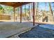 Covered patio with stone and concrete surfaces, as well as staircase access to deck at 2003 Hubbard Ct, Villa Rica, GA 30180