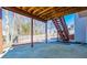Covered patio with access stairs to back yard and deck at 2003 Hubbard Ct, Villa Rica, GA 30180