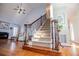 Staircase with carpeted steps, ornate wrought iron spindles, and wood railing leading to the upper level at 2003 Hubbard Ct, Villa Rica, GA 30180