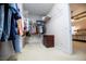 Organized walk-in closet with shelving, hanging rods, and a view into the primary bedroom at 2003 Hubbard Ct, Villa Rica, GA 30180