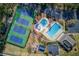 Aerial view featuring a community pool and tennis courts at 2385 Cape Courage Way, Suwanee, GA 30024